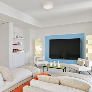 Photo of a contemporary home cinema in Miami with white walls, a wall mounted tv and white floors.