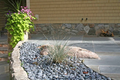 Mid-sized arts and crafts side yard shaded outdoor sport court in Other with natural stone pavers for summer.