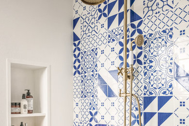 Mid-sized trendy 3/4 blue tile, white tile and porcelain tile bathroom photo in San Francisco with white walls