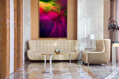 Example of a minimalist marble floor living room design in Miami with white walls