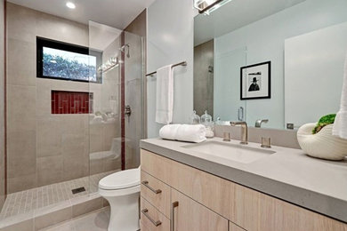 Bathroom - mid-sized transitional 3/4 gray tile and ceramic tile cement tile floor and gray floor bathroom idea in Toronto with flat-panel cabinets, light wood cabinets, a one-piece toilet, gray walls, an undermount sink, concrete countertops and brown countertops