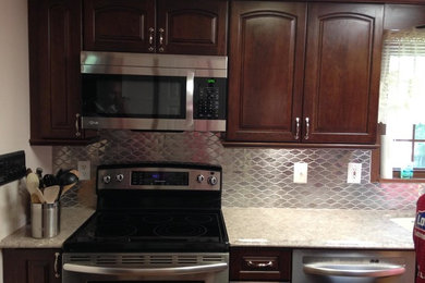 Kitchen - transitional kitchen idea in Other