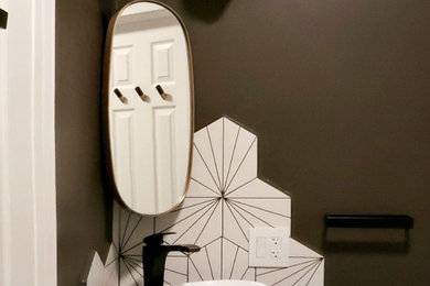 Example of a trendy powder room design in New York