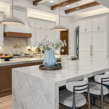 Modern Open-Concept Kitchen with Taj Mahal Quartzite Waterfall Social Island and