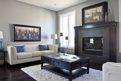 Mid-sized transitional formal and enclosed dark wood floor living room photo in Calgary with gray walls, a standard fireplace, a tile fireplace and no tv