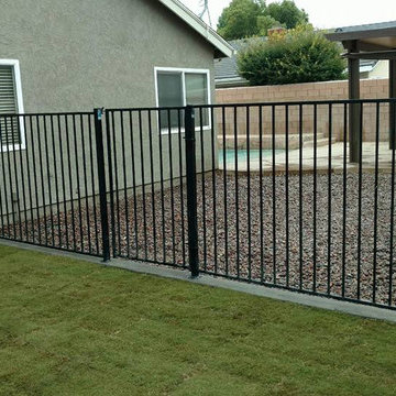 Bermuda Sod, River rock, fence placement