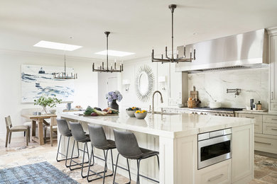 Large transitional l-shaped travertine floor and beige floor eat-in kitchen photo in Other with recessed-panel cabinets, gray cabinets, quartzite countertops, white backsplash, stone slab backsplash, paneled appliances, an island, white countertops and a single-bowl sink