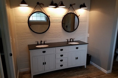 Bathroom - mid-sized country master porcelain tile bathroom idea in Dallas with furniture-like cabinets, white cabinets, an undermount sink and solid surface countertops