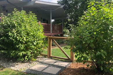 Photo of a small rustic side yard landscaping in Denver.