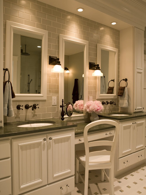 What decor matches with white bathroom sink cabinets?