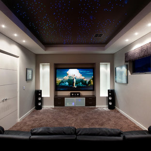 Home theater - contemporary enclosed carpeted and brown floor home theater idea in Perth with a projector screen and gray walls