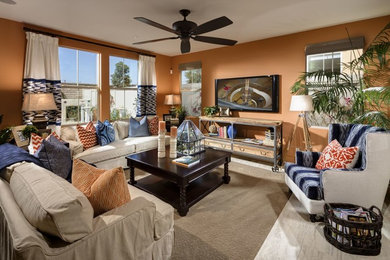 Photo of a mid-sized transitional enclosed family room in San Diego with orange walls, porcelain floors, no fireplace, a wall-mounted tv and grey floor.