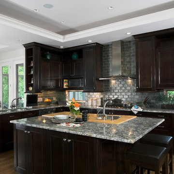 Dark cherry cabinets, stainless exhaust, butcher block island