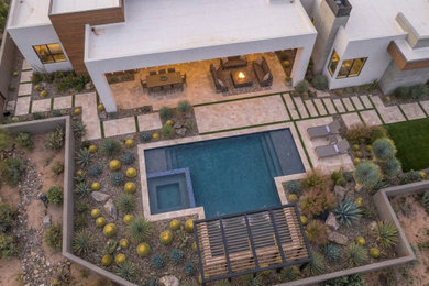 Example of a small minimalist backyard concrete paver and custom-shaped pool landscaping design in Los Angeles