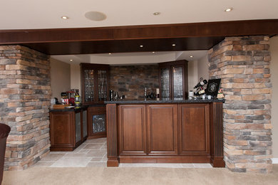 Example of a single-wall ceramic tile wet bar design in Toronto with raised-panel cabinets, dark wood cabinets, granite countertops and multicolored backsplash
