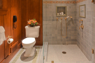 Arts and crafts bathroom in San Francisco with an undermount sink, recessed-panel cabinets, medium wood cabinets, a freestanding tub, a corner shower, blue tile and ceramic tile.