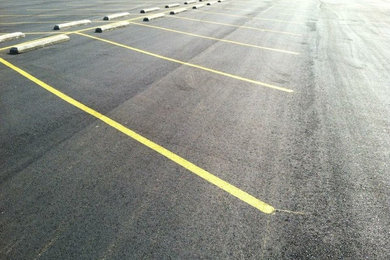 Commercial asphalt and concrete parking.