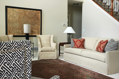 Example of a mid-sized transitional open concept carpeted and beige floor living room design in Other with beige walls, a standard fireplace, a stone fireplace and a wall-mounted tv