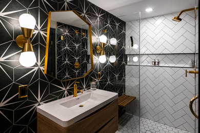 This is an example of a mid-sized transitional 3/4 bathroom in DC Metro with flat-panel cabinets, dark wood cabinets, an alcove tub, an alcove shower, multi-coloured tile, porcelain tile, multi-coloured walls, porcelain floors, an integrated sink, solid surface benchtops, white floor, a hinged shower door and white benchtops.
