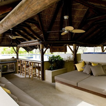 Thatch & timber is the is the focal point of this beautifully landscaped garden