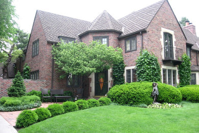 Photo of a large traditional full sun front yard brick garden path in Other.
