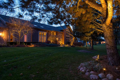 This is an example of a large traditional front yard lawn edging in Portland.
