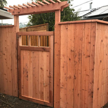 Con heart redwood fence utilizing 1x8 fence boards with gate & arbor