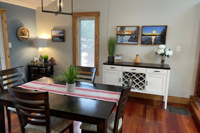 Kitchen/dining room combo - mid-sized transitional dark wood floor kitchen/dining room combo idea in Other with gray walls