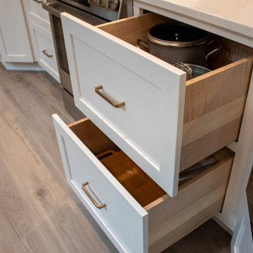 3 Finishes on Kitchen Cabinetry with Galley Workstation in Island and Wine Bar