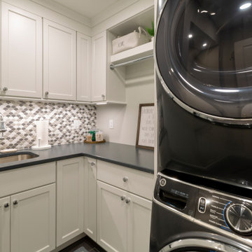 Cozy Laundry Room with Stacked Washer Dryer