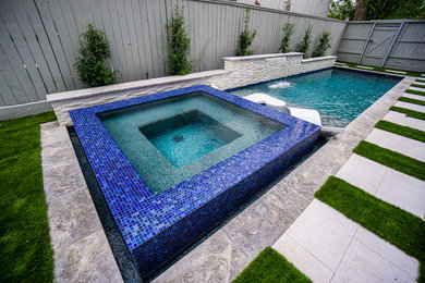Pool - small contemporary backyard stone and rectangular pool idea in Houston