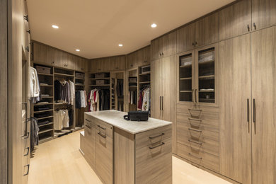 Walk-in closet - large contemporary light wood floor and beige floor walk-in closet idea in San Francisco with flat-panel cabinets and medium tone wood cabinets