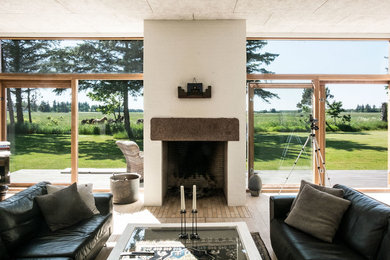 Living room - mid-sized scandinavian formal and enclosed light wood floor living room idea in Aalborg with white walls, a standard fireplace, a tile fireplace and no tv