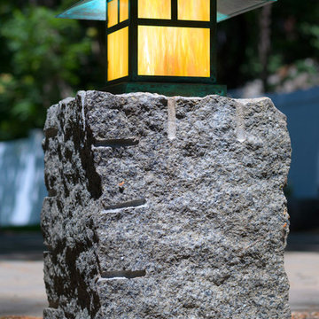 Lantern on reclaimed granite post