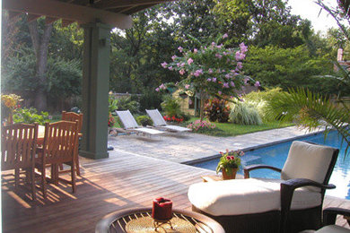Large elegant backyard brick and rectangular lap pool photo in DC Metro