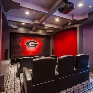 This is an example of a medium sized contemporary enclosed home cinema in Miami with red walls, carpet and a projector screen.