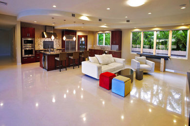 Inspiration for an open concept living room remodel in Hawaii with yellow walls and no fireplace