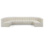 Meridian Furniture - Arc Vegan Leather Upholstered 8-Pc. U-Shaped Modular Sectional, Cream - Unleash modern opulence with the Arc Vegan Leather 8pc. Sectional. Crafted for the modern connoisseur, this Sectional injects an air of refined luxury into any space. Its sleek silhouette, upholstered in supple cream vegan leather, exudes timeless sophistication while the deep channel tufting adds textural intrigue, further elevating the chair's visual appeal. The modular design makes it a versatile chameleon, effortlessly adapting to your evolving needs and preferences. Whether you envision it gracing a chic living room corner, basking in the glow of a bedroom window, or adding a touch of drama to a home office, the Arc seamlessly complements your unique interior aesthetic.