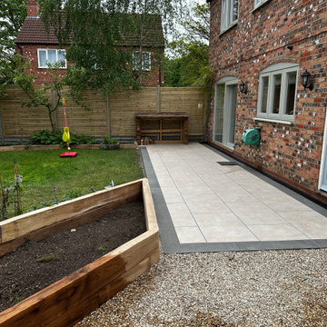 Sleeper Beds and Gravel Either Side of a Porcelain Terrace