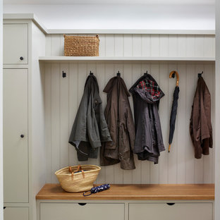Inspiration for a classic utility room in Other with flat-panel cabinets.