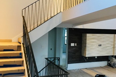 Staircase - contemporary metal railing staircase idea in Denver