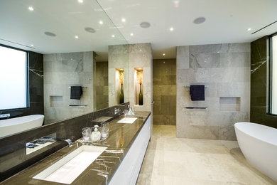 Photo of a mid-sized modern master bathroom in Melbourne with brown cabinets, white tile, stone slab and quartzite benchtops.