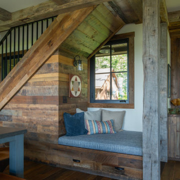 Hand Hewn Timbers and Reclaimed Wood Paneling in a Rustic Cabin Kitchen