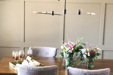Example of a transitional dining room design in Other
