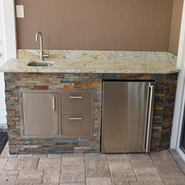 Outdoor kitchen with separate server area.