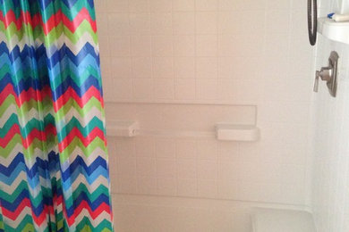 Mid-sized beach style master laminate floor walk-in shower photo in Jacksonville with green walls