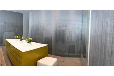 Large minimalist gender-neutral walk-in closet photo in Other