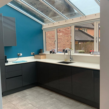 Bright L shape kitchen with large windows