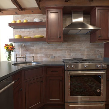 Brick Backsplash Brings out Red Tones from Alder Cabinets
