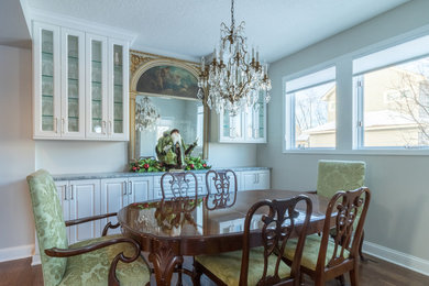 Mid-sized traditional separate dining room in Minneapolis with white walls, dark hardwood floors and no fireplace.